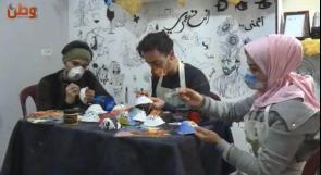 "الفن في زمن الكورونا".. كمامات برسومات فنية لنشر ثقافة الوقاية من الفيروس في غزة