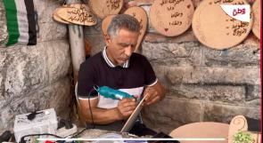 رغم إعاقته.. النتشة يبدع في فن الحرق على الخشب وسط الخليل