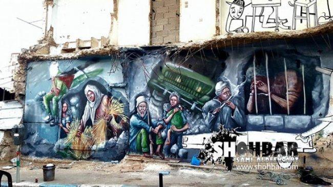 الاحتلال والحصار.. جدارية وسط رام الله تحمل هموم المواطن